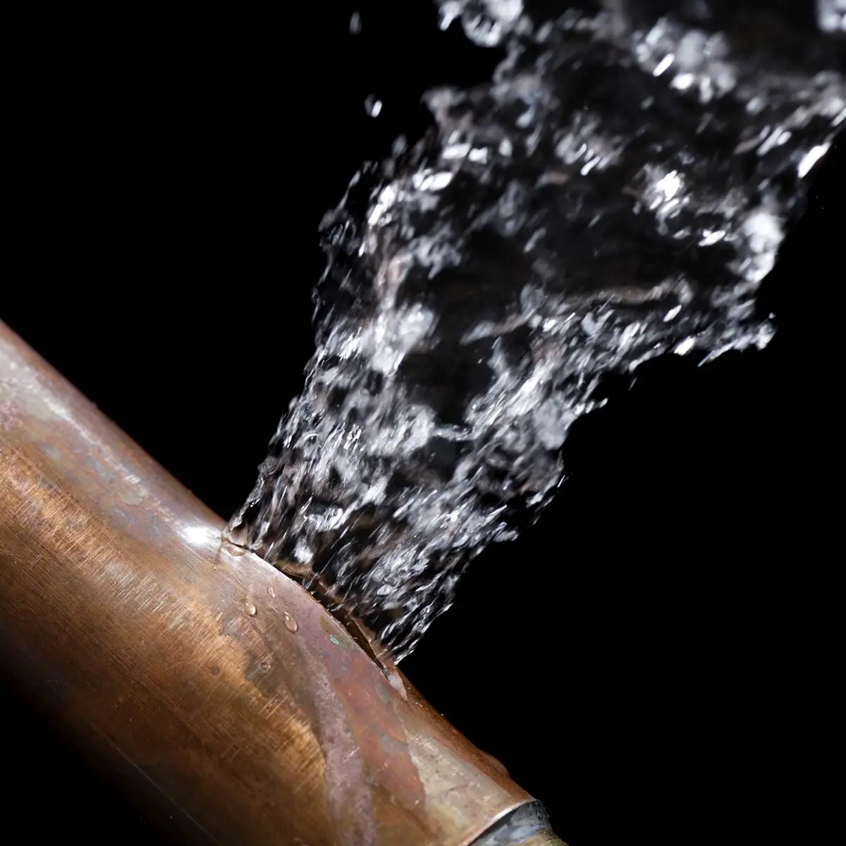 JRS Group Ltd emergency plumber responding to a burst pipe in Surrey