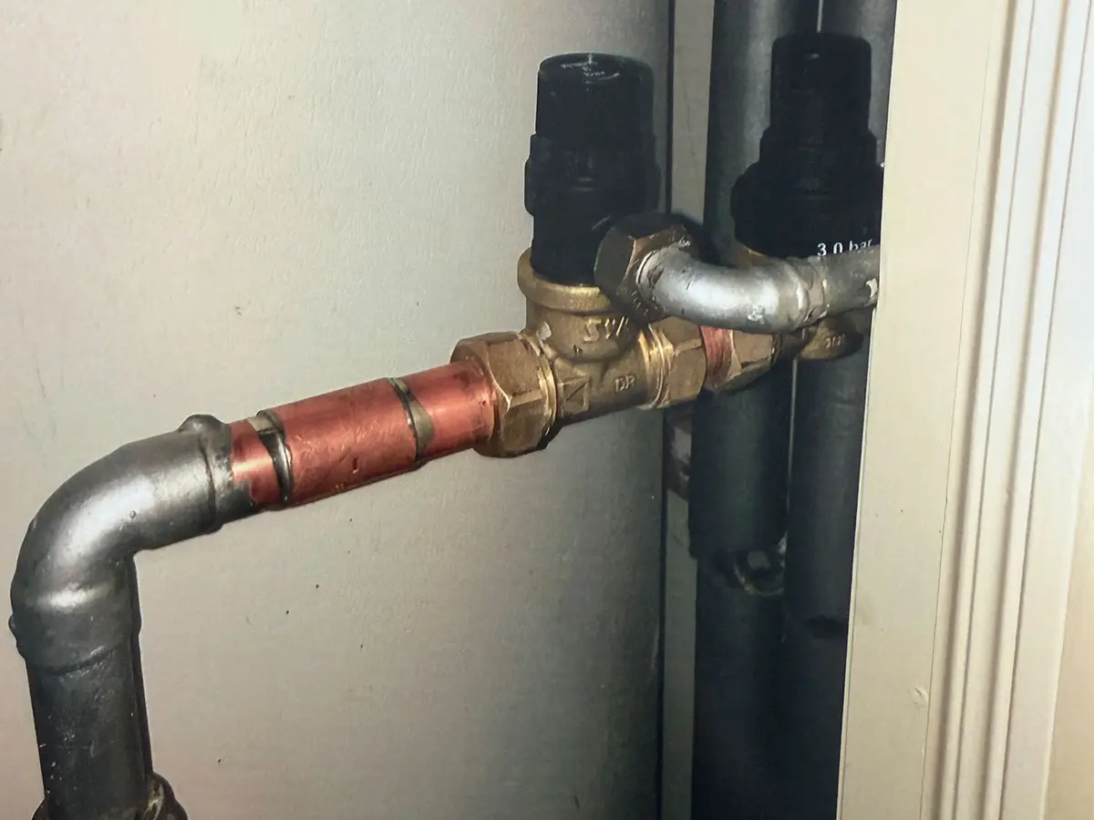 Gas engineer servicing a boiler in Surrey
